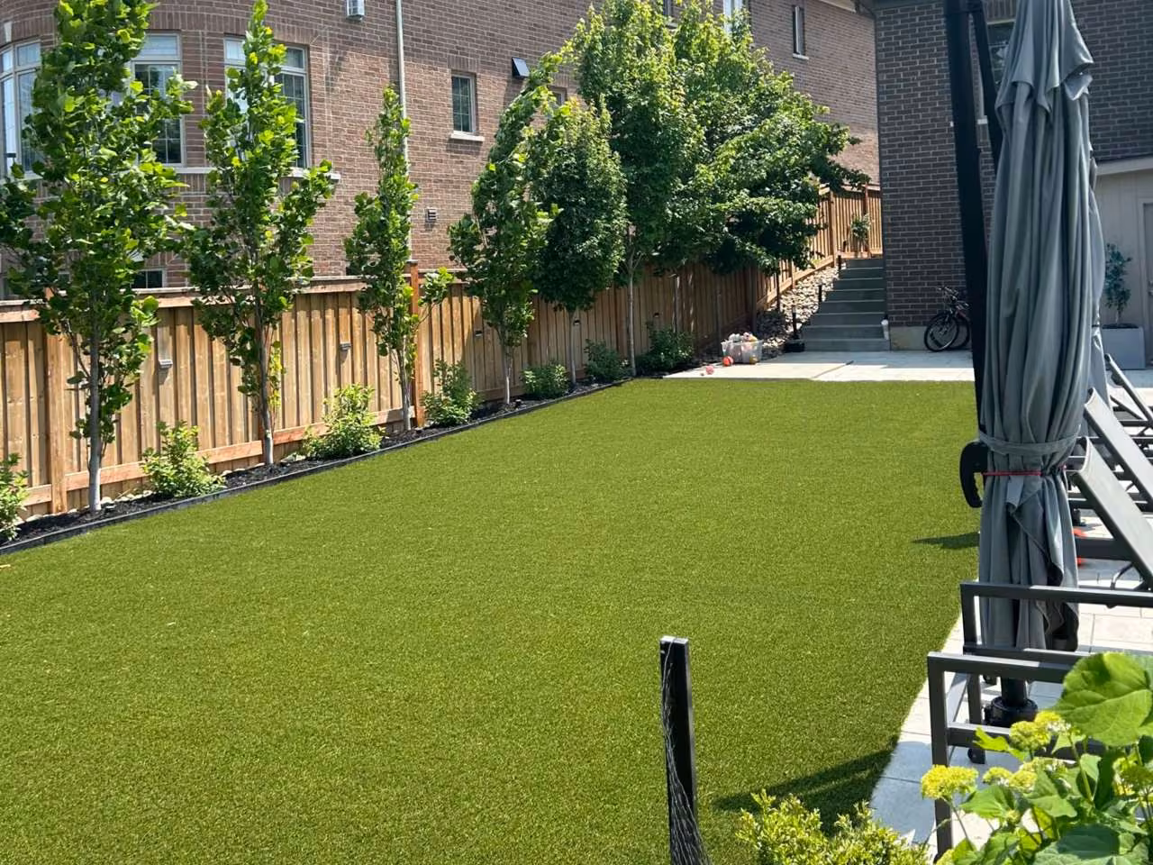 Artificial turf installed around a pool