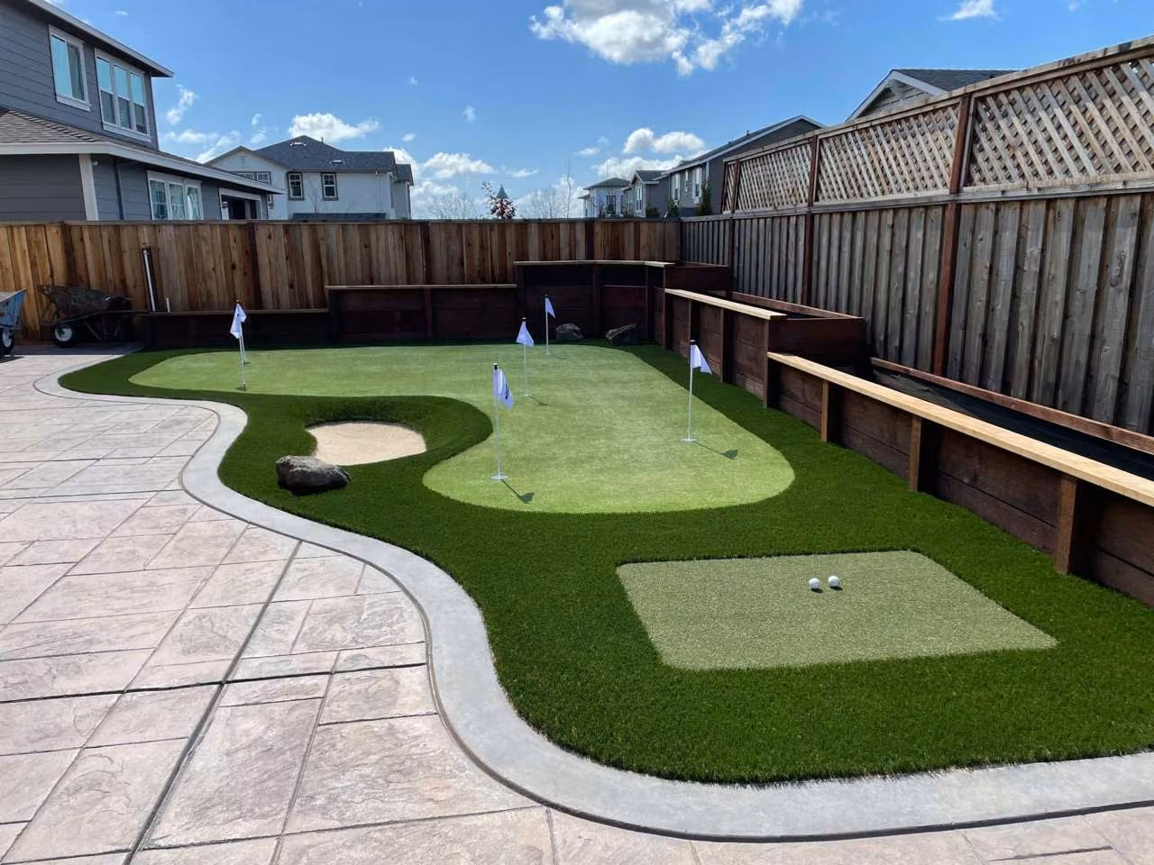 Backyard putting green with synthetic turf